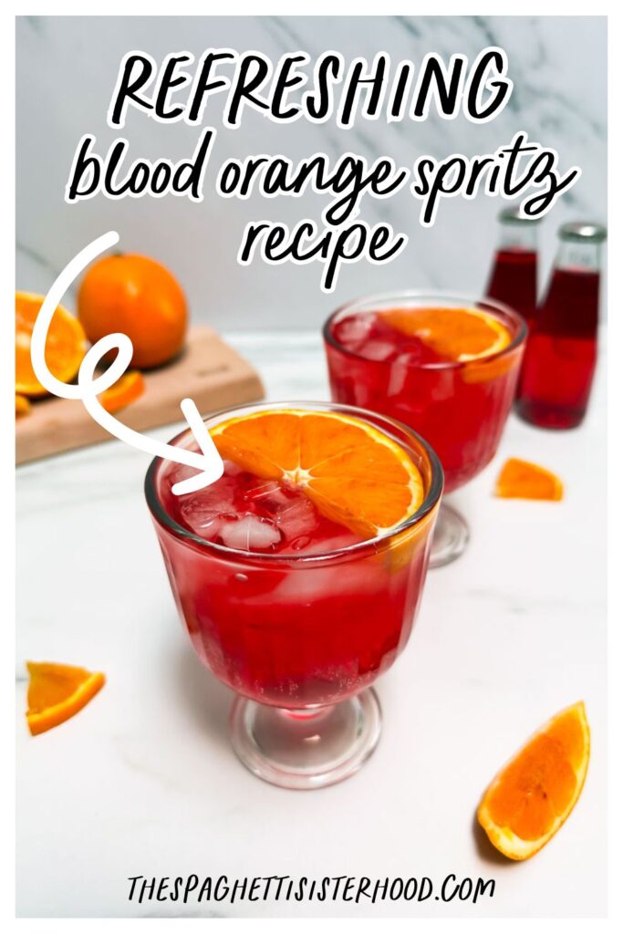 Blood orange spritz in two glasses, blood oranges behind and two bottles of bitter