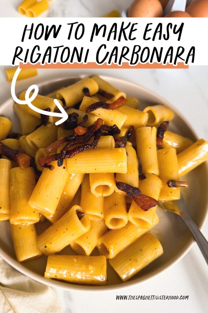 close up rigatoni alla carbonara in a plate, rigatoni and eggs on the background 