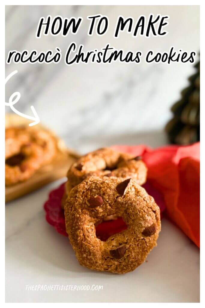 pin image - stack of roccocò cookies on a red plate and towel, in the background more cookies on a wooden board and a christmas tree ornament, on a marble background